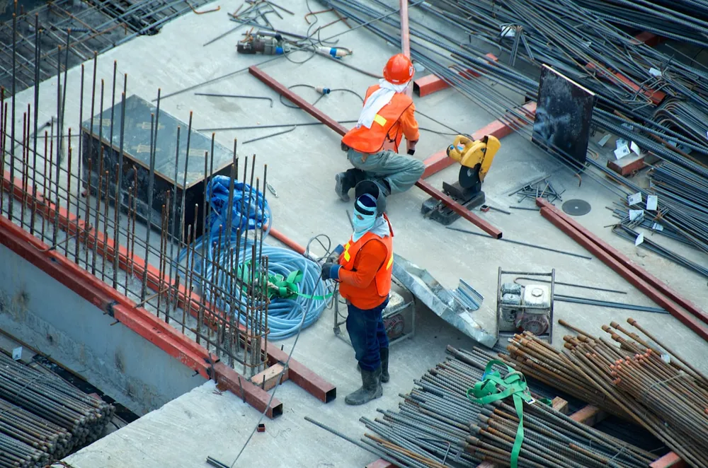 Construction engineers looking up